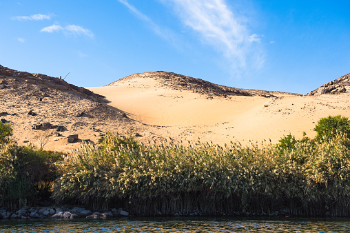 Sand dunes on the Coastline of the Nile river part called First Cataract, Aswan, Egypt