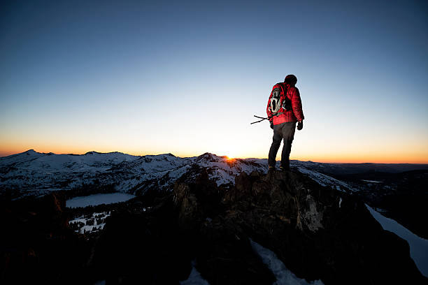 istock climber on the summit of a peak 467513824