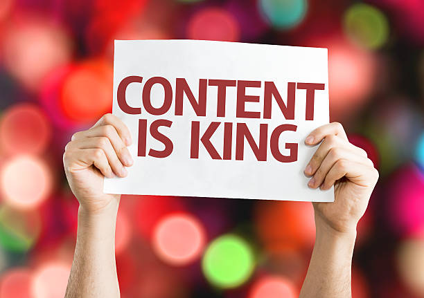 istock Content is King card with colorful background with defocused lights 467514116