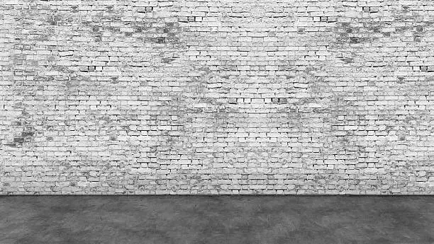 Photo of Long empty white brick wall and foreground