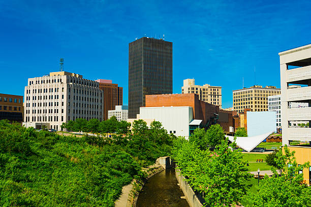 Akron downtown skyline, trees, and the Ohio and Erie Canal Downtown Akron skyline w/ highrise buildings, trees, and the Ohio and Erie Canal. akron ohio stock pictures, royalty-free photos & images