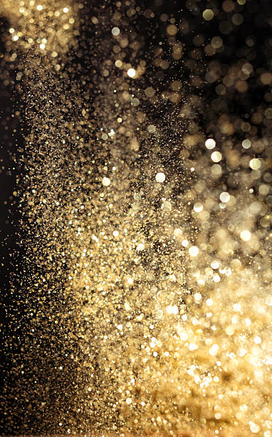 istock Golden splashing raindrops in the light 467521027