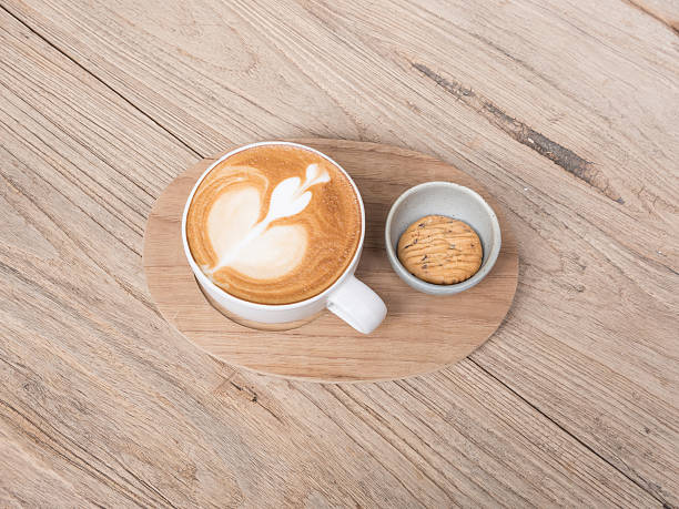 istock cup of coffee  with cookie on wooden background 467524166
