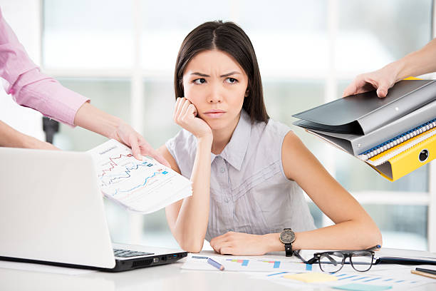 istock Sad young businesswoman with folders 467525300