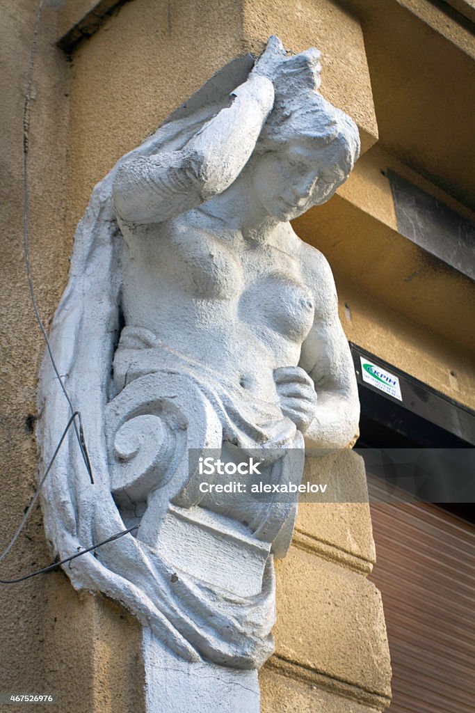 Urban Baroque sculptures on the walls Beautiful stone and marble sculpture on the wall of the houses in the Baroque style in Ukraine 2015 Stock Photo