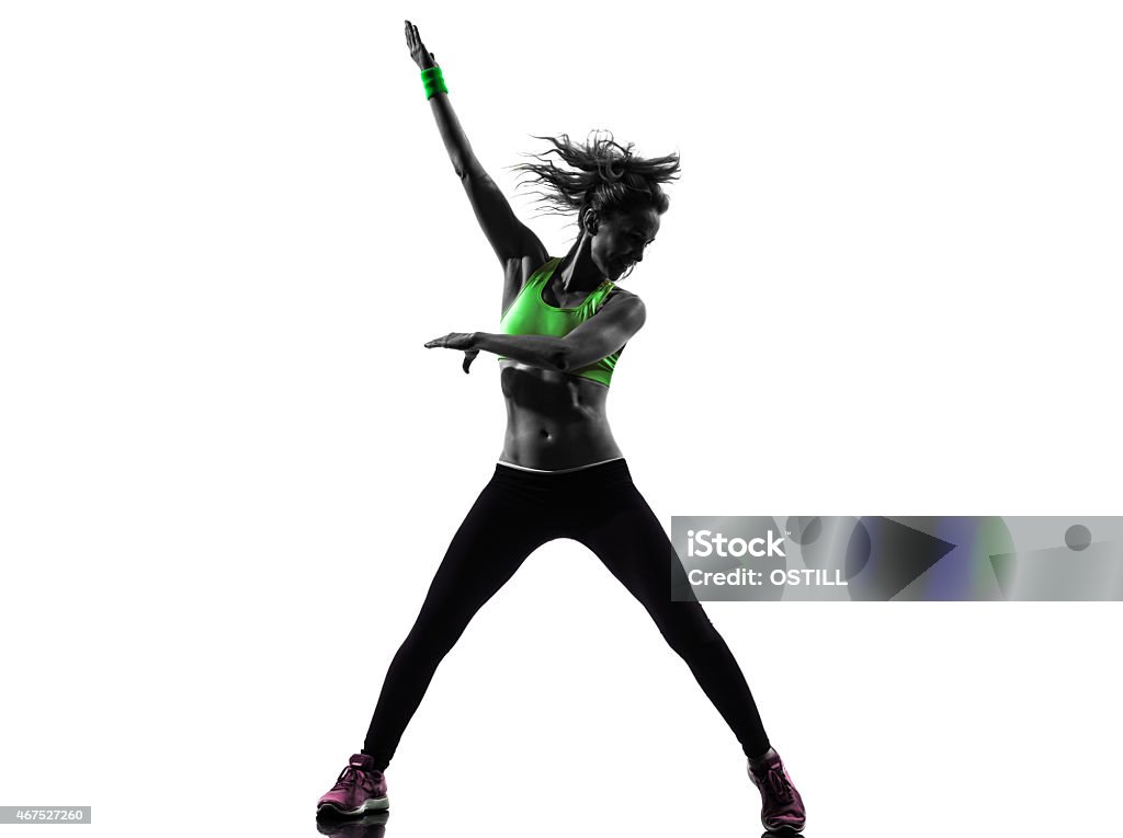 Grayscale woman wearing green sports bra doing exercises woman exercising fitness dancing silhouette 2015 Stock Photo