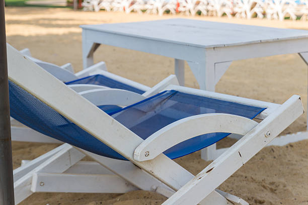 istock blue and white wooden beach chair 467527876