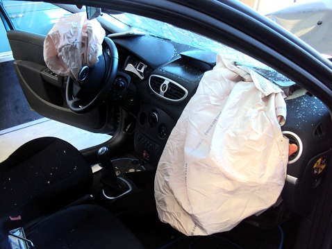 Driver and passenger airbags deployed, inside after wreck