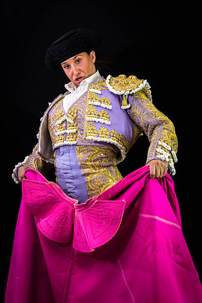 istock Woman bullfighter holding capote pink 467528926