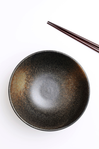 rice bowl and chopsticks on white background