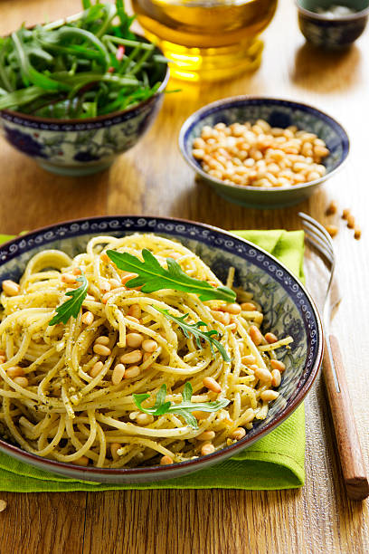 istock Spaghetti with pesto of arugula with pine nuts. 467532226