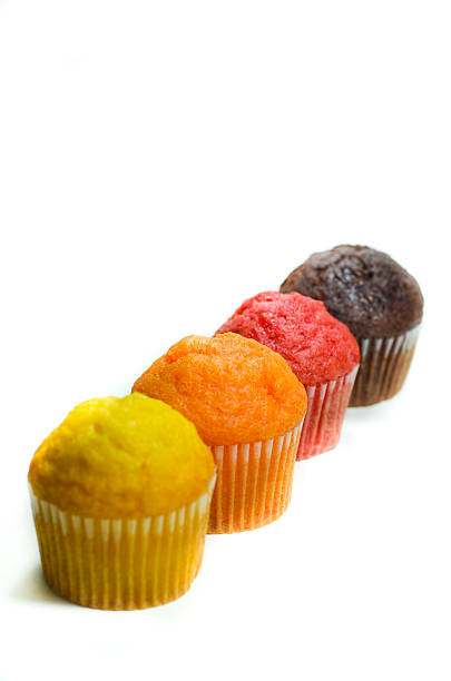 istock tasty muffin cakes, isolated on white 467534356