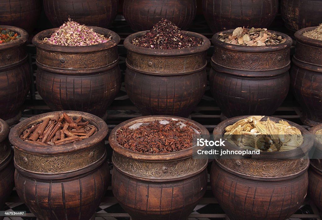 Urns of Spices and herbs. Marrakesh, Morocco. Morocco, Marrakesh, Spices, herbs and dried rosebuds in one of the Medina's many souks. Anise Stock Photo