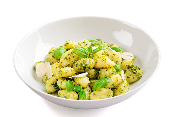 istock Gnocchi with pesto sauce isolated on white, 467535543