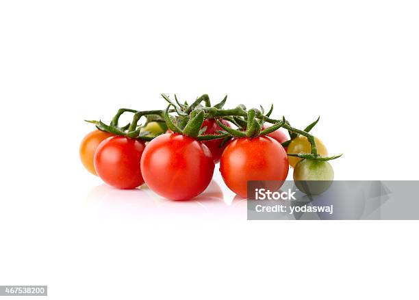 Fresh Cherry Tomatoes With Stem Isolated On White Background Stock Photo - Download Image Now