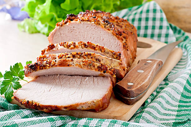 istock Cut pieces of baked meat on the table 467539070