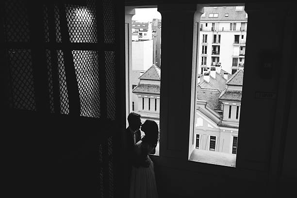 istock Groom and gorgeous bride in hotel room 467543322