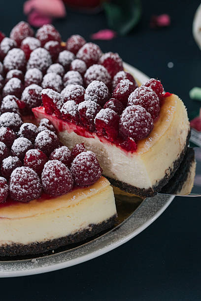 Slice being taken from a raspberry cheesecake