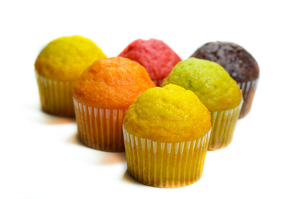 istock tasty muffin cakes, isolated on white 467544142