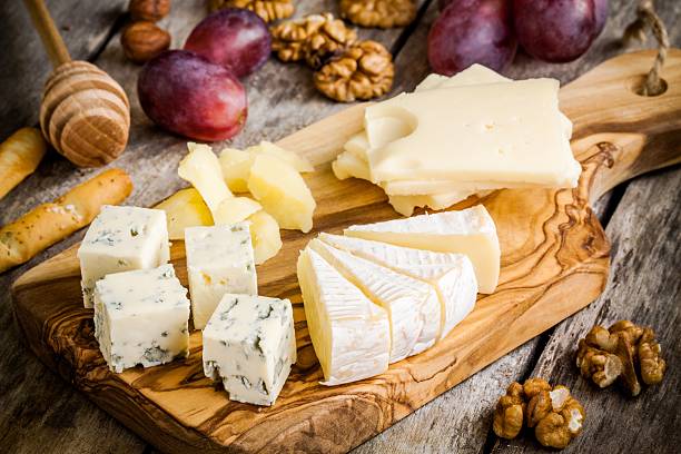 istock Emmental, Camembert, Parmesan, blue cheese, with walnuts and grape 467544222