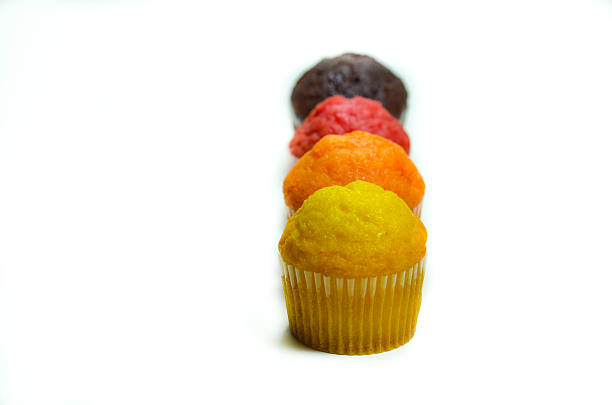 istock tasty muffin cakes, isolated on white 467544436