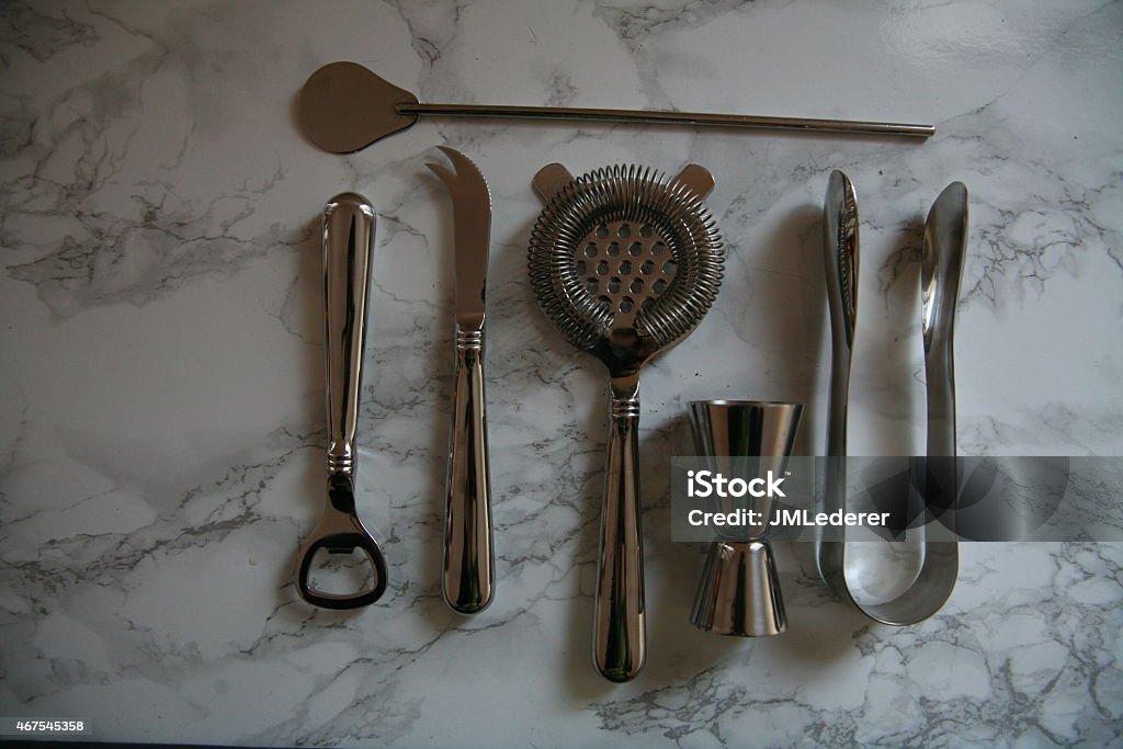 Bar tools Set of chrome bar tools arranged neatly on a marble countertop. 2015 Stock Photo