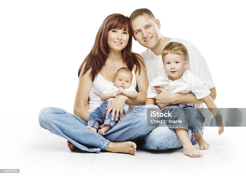 Young family four persons, smiling father mother and two children Young family four persons, smiling father mother and two children sons, over white background. White Background Stock Photo