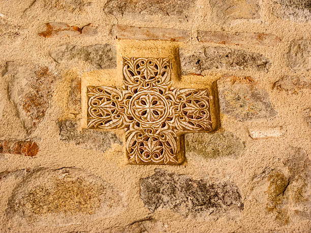 istock Ancient Greek Cross on the Stone Wall 467549388