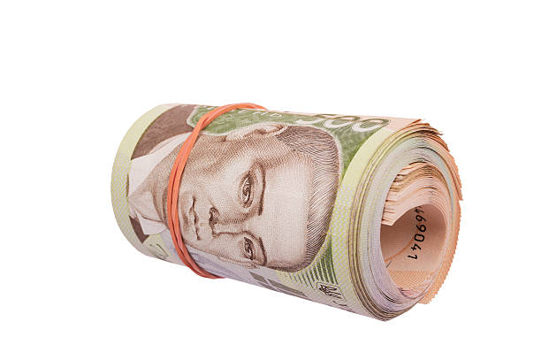 istock roll of ukrainian hryvna bills isolated over white 467550340