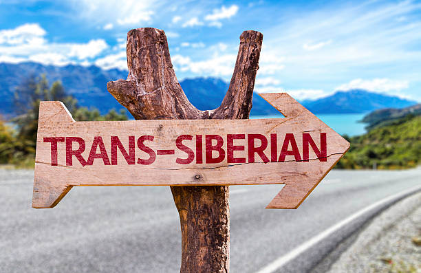 Trans-Siberian wooden sign with a railway on background Trans-Siberian wooden sign with a railway on background golden ring of russia photos stock pictures, royalty-free photos & images