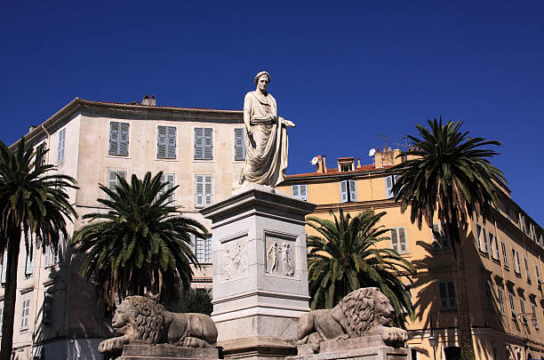 France, Corsica, Ajaccio historical center - fountain and statue of Napoleon in Roman dress. The fountain in Corsican granite was built in 1827 following designs by Maglioli. The marble statue - of Bonaparte as First Consul - is the work of Maximilien Laboureur.