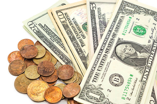 istock Us dollar bills and coins on white background. 467552990