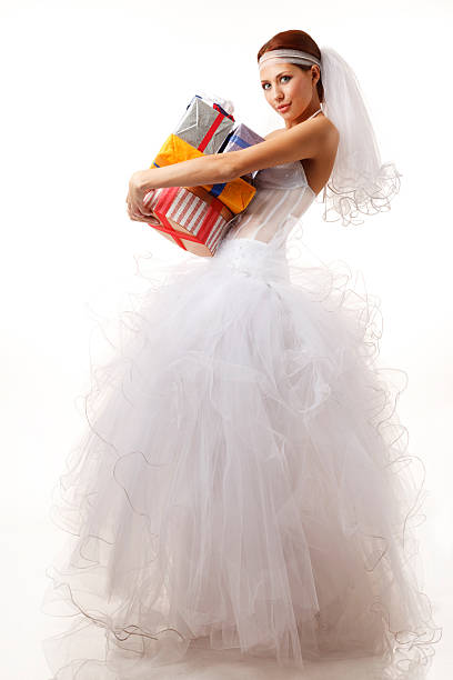 Classical bride with presents on the white background stock photo