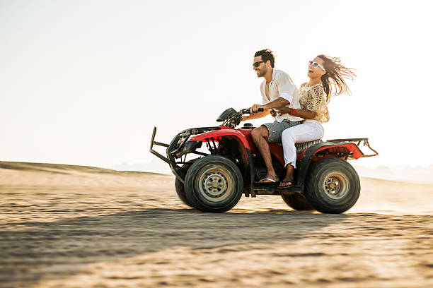 istock Cheerful couple having fun on a quad bike. 467553568