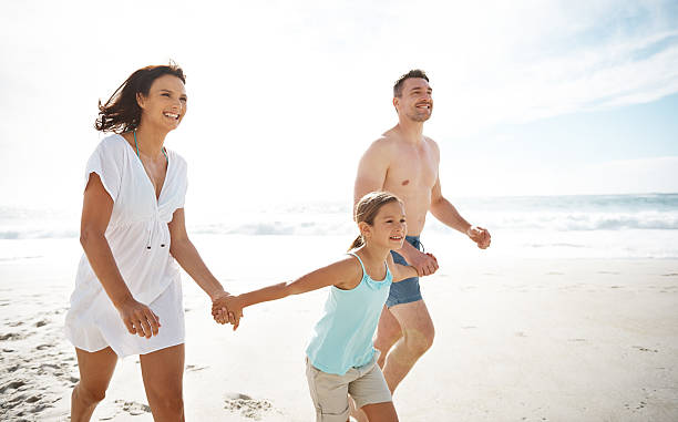 istock Come on Mom and Dad, let's build a sandcastle 467553868