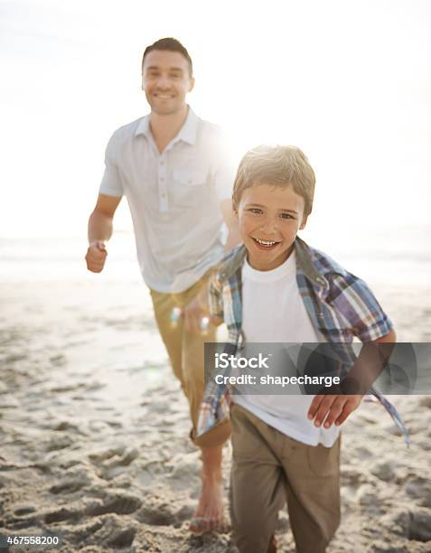 The Beautiful Bond Between A Father And Son Stock Photo - Download Image Now - Father, Beach, Boys