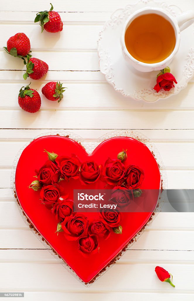 Chocolate and strawberry mousse cake in the shape of heart. 2015 Stock Photo