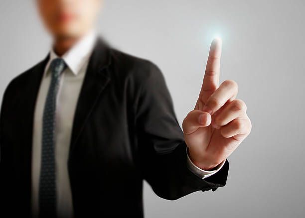 istock businessman with financial symbols 467560204
