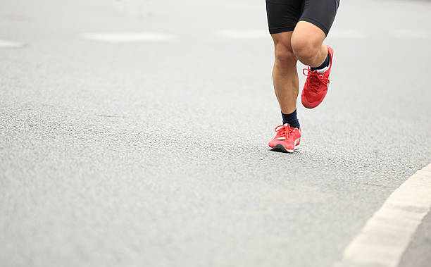 istock marathon runner athlete running on city road 467561012