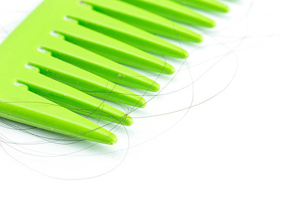istock Green comb with hair 467561400
