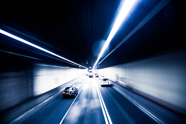 istock Truck light trails in tunnel 467561498