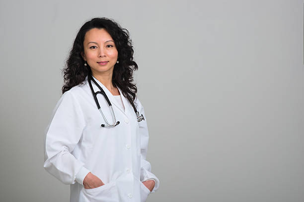 istock Asian female doctor with stethoscope 467562022