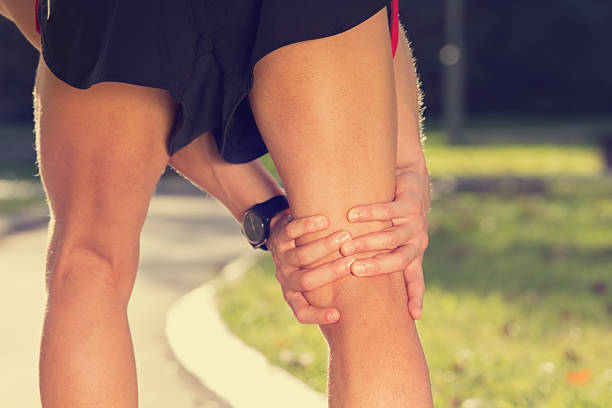 Jogging Injury Always warm-up before jogging or injury occurs... human knee stock pictures, royalty-free photos & images