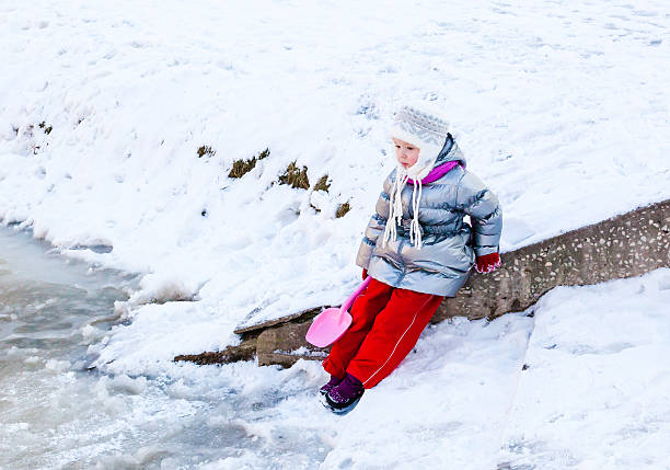 istock Little girl playing outdoors in winter 467563070