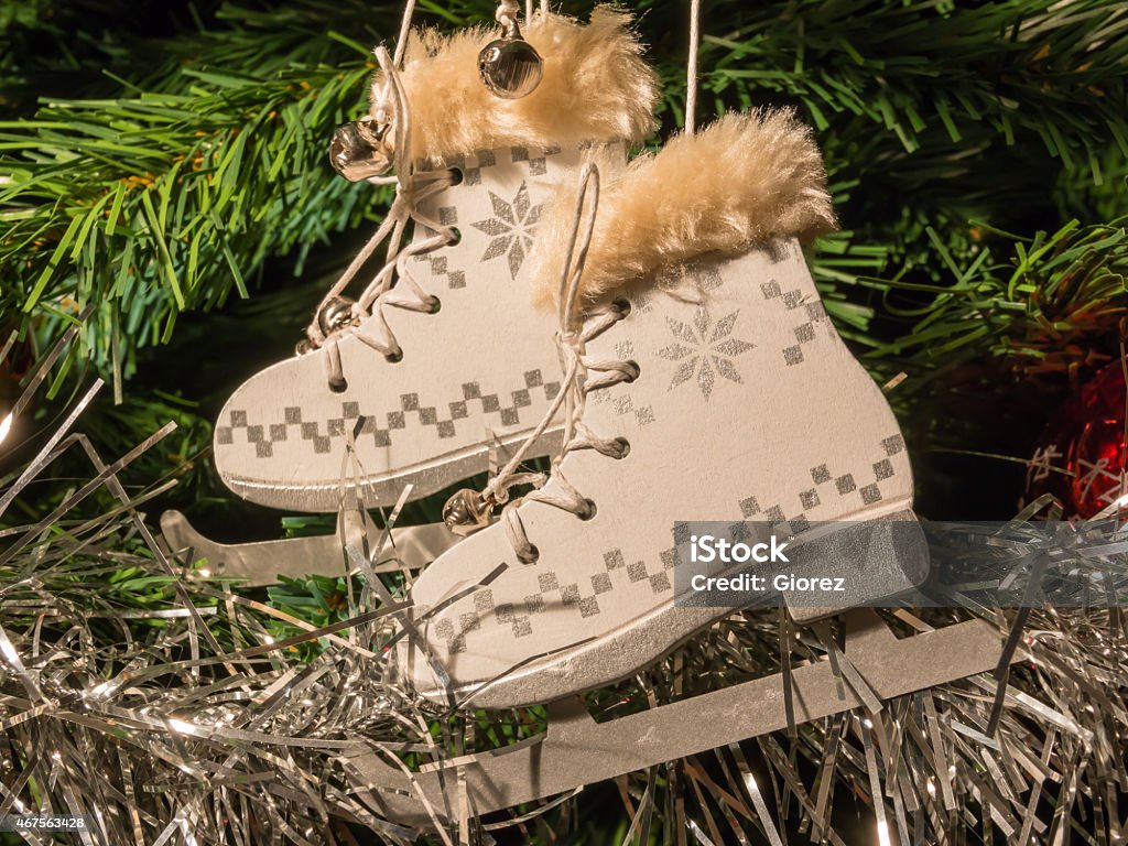 white ice skate Christmas Decoration on christmas tree white ice skate Christmas Decoration on green christmas tree 2015 Stock Photo