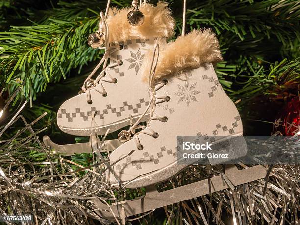 White Ice Skate Christmas Decoration On Christmas Tree Stock Photo - Download Image Now