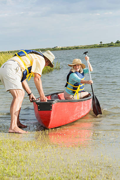 istock Senior couple canoeing on Intracoastal waterway, Florida 467565005