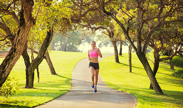 istock Young woman jogging running outdoors 467566705