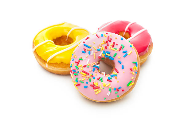 istock Three delicious donuts with colorful frosting and sprinkles 467568321