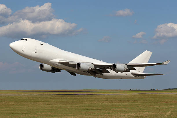 istock Low pass of big white plane 467571054